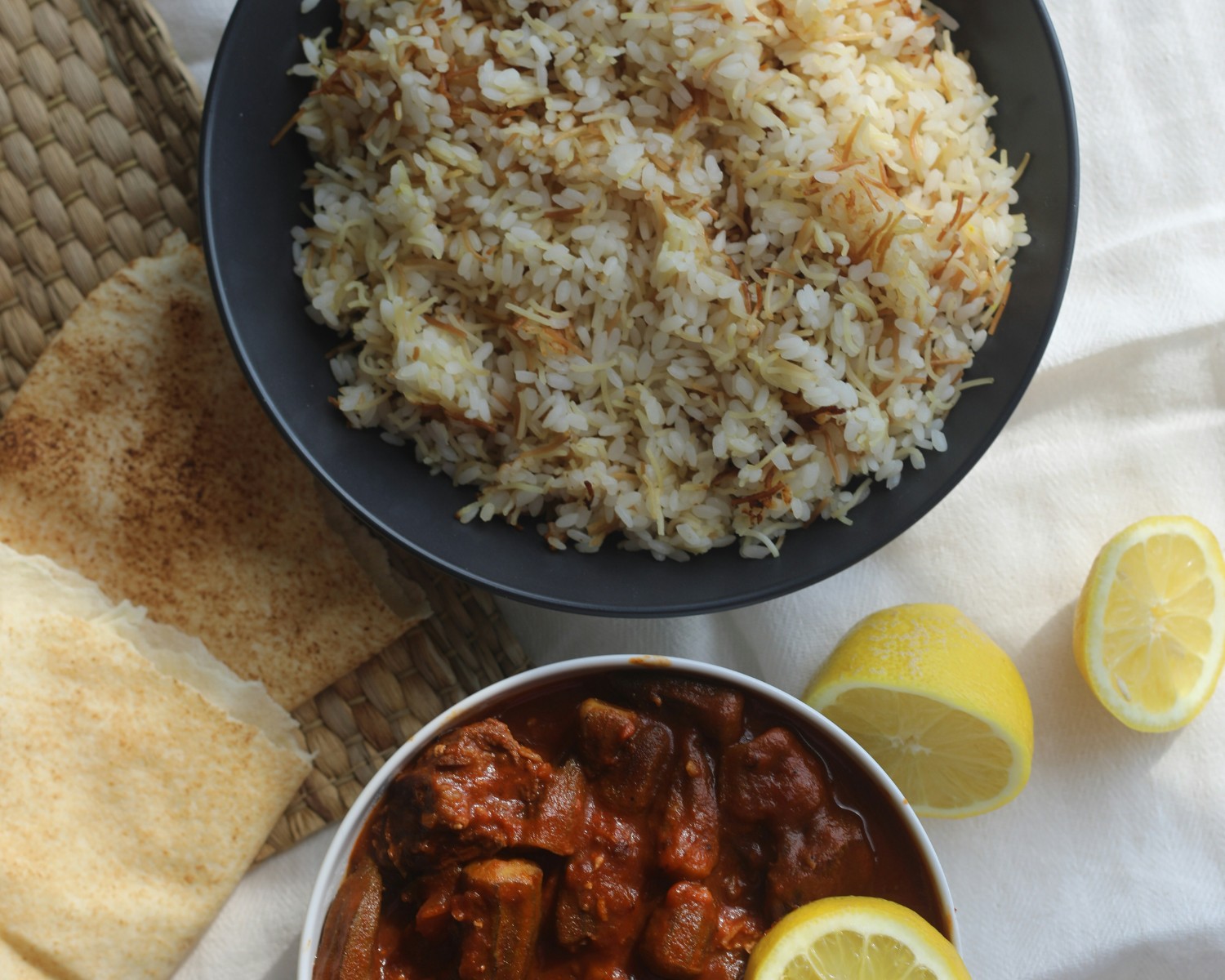 Koshari served with spicy sauce and onions