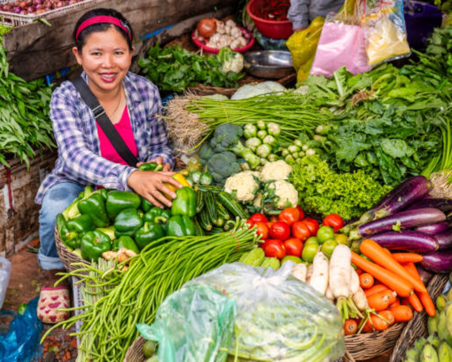 Locals shopping and selling at a bustling morning market